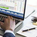 black-businessman-using-computer-laptop-150x150